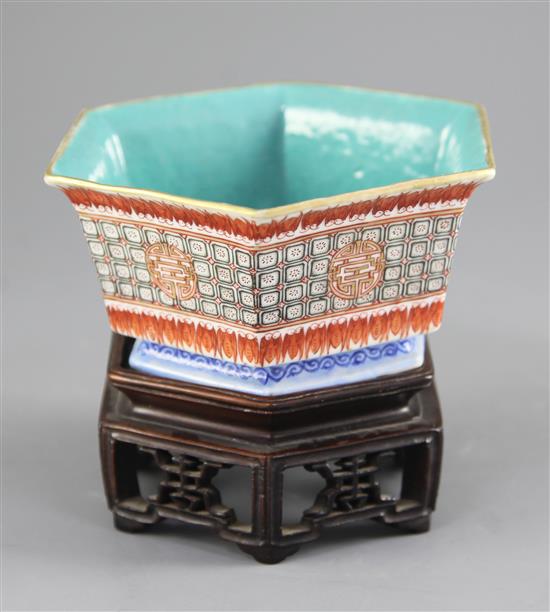 A Chinese enamelled porcelain hexagonal bowl, Xianfeng seal mark and of the period (1851-61), 15.7cm, original fitted hongmu stand pier